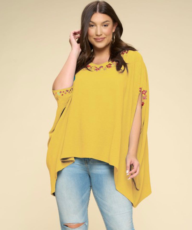 PLUS PONCHO WITH FLORAL DETAILS